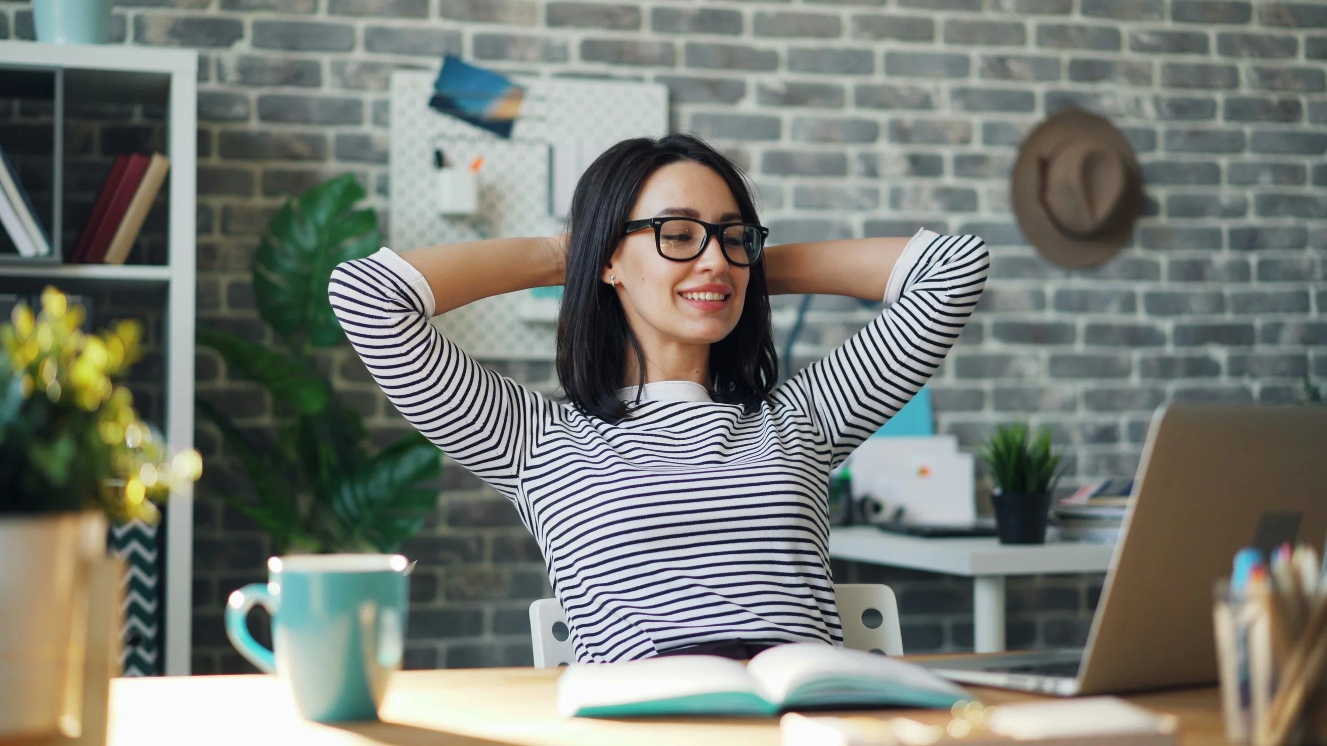 Young woman using a laptop in a modern office