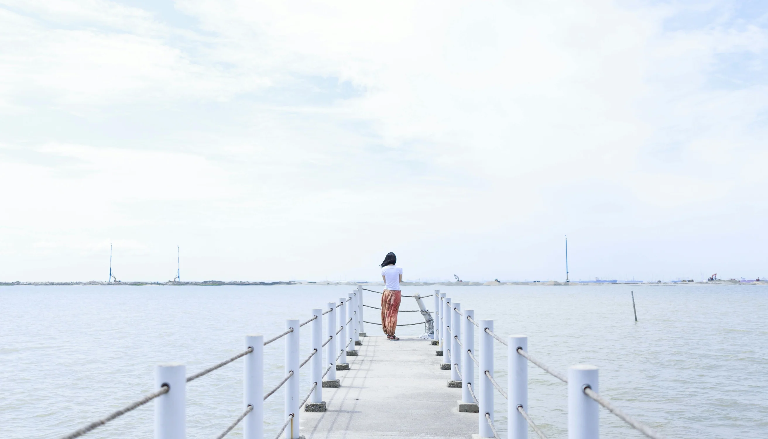 Woman standing on dock