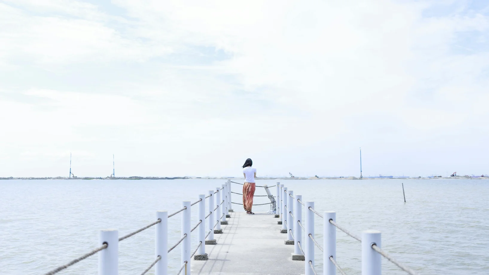 Woman standing on dock