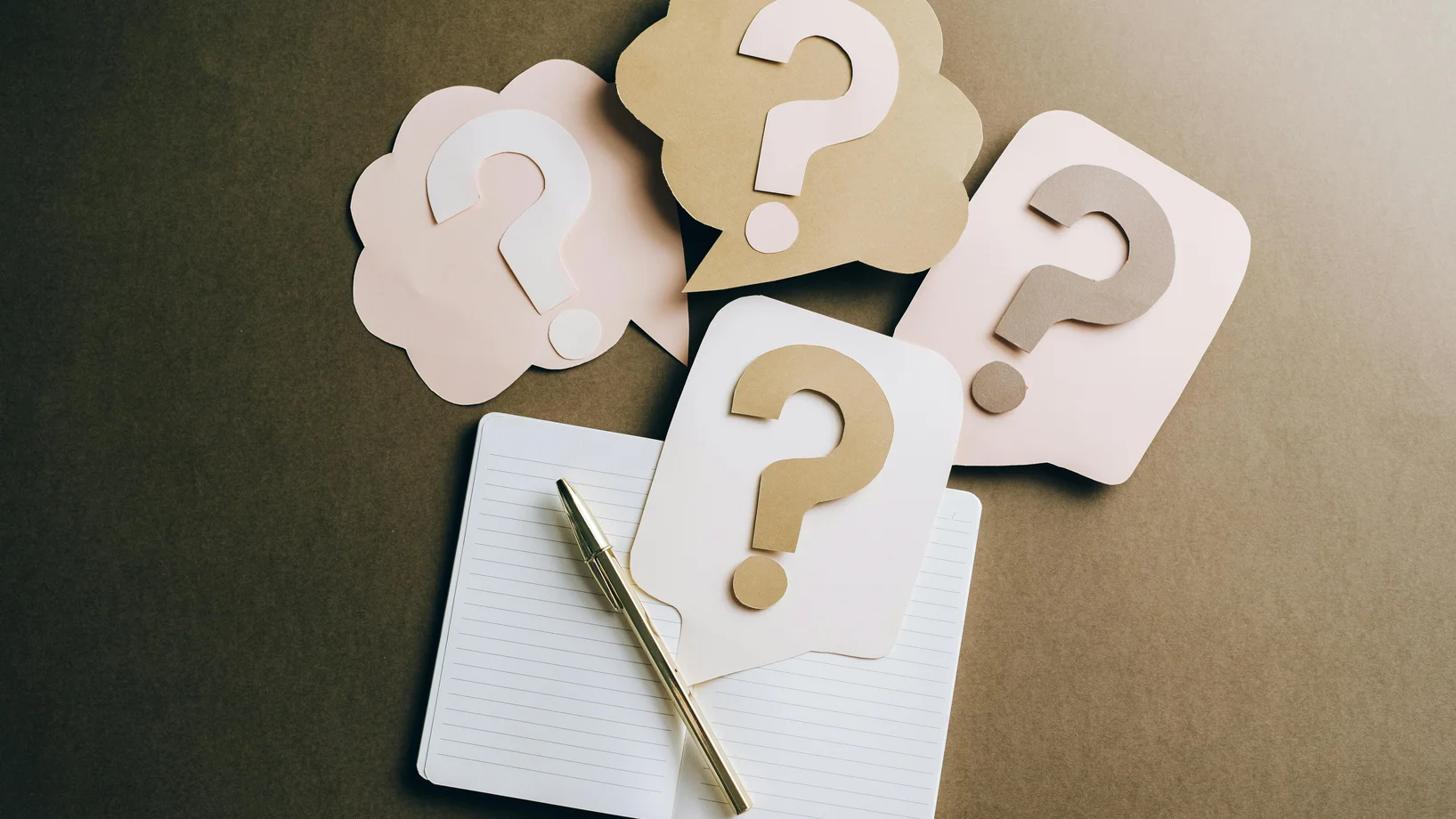Question marks on craft paper