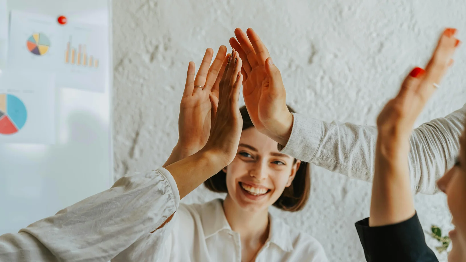 Group of people doing high five