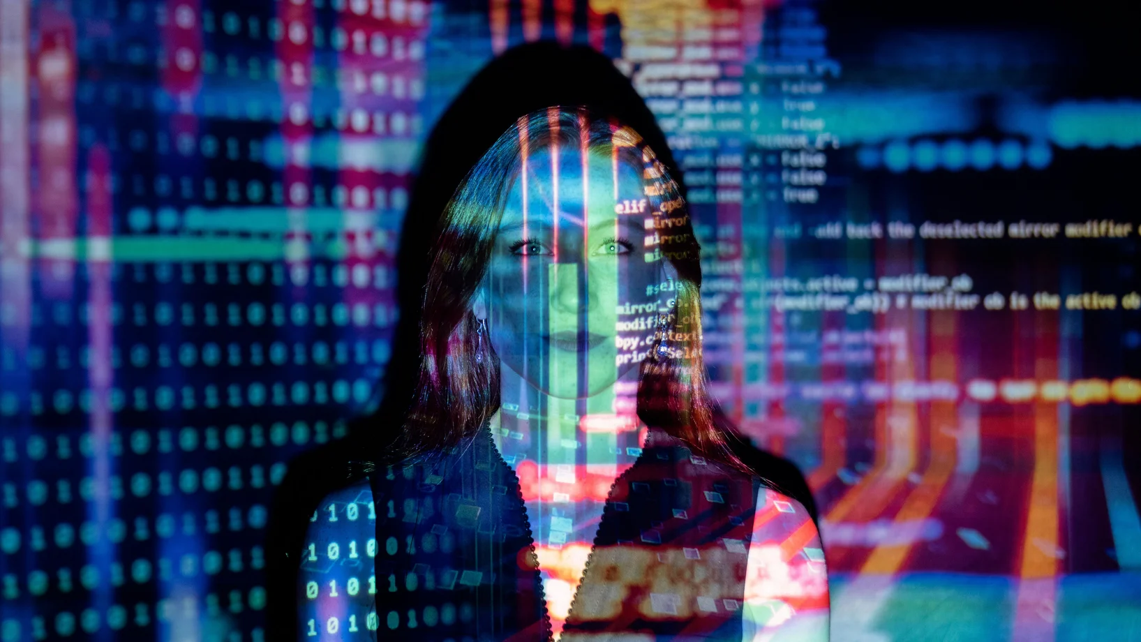 A woman with digital code projections on her face, representing technology and future concepts.