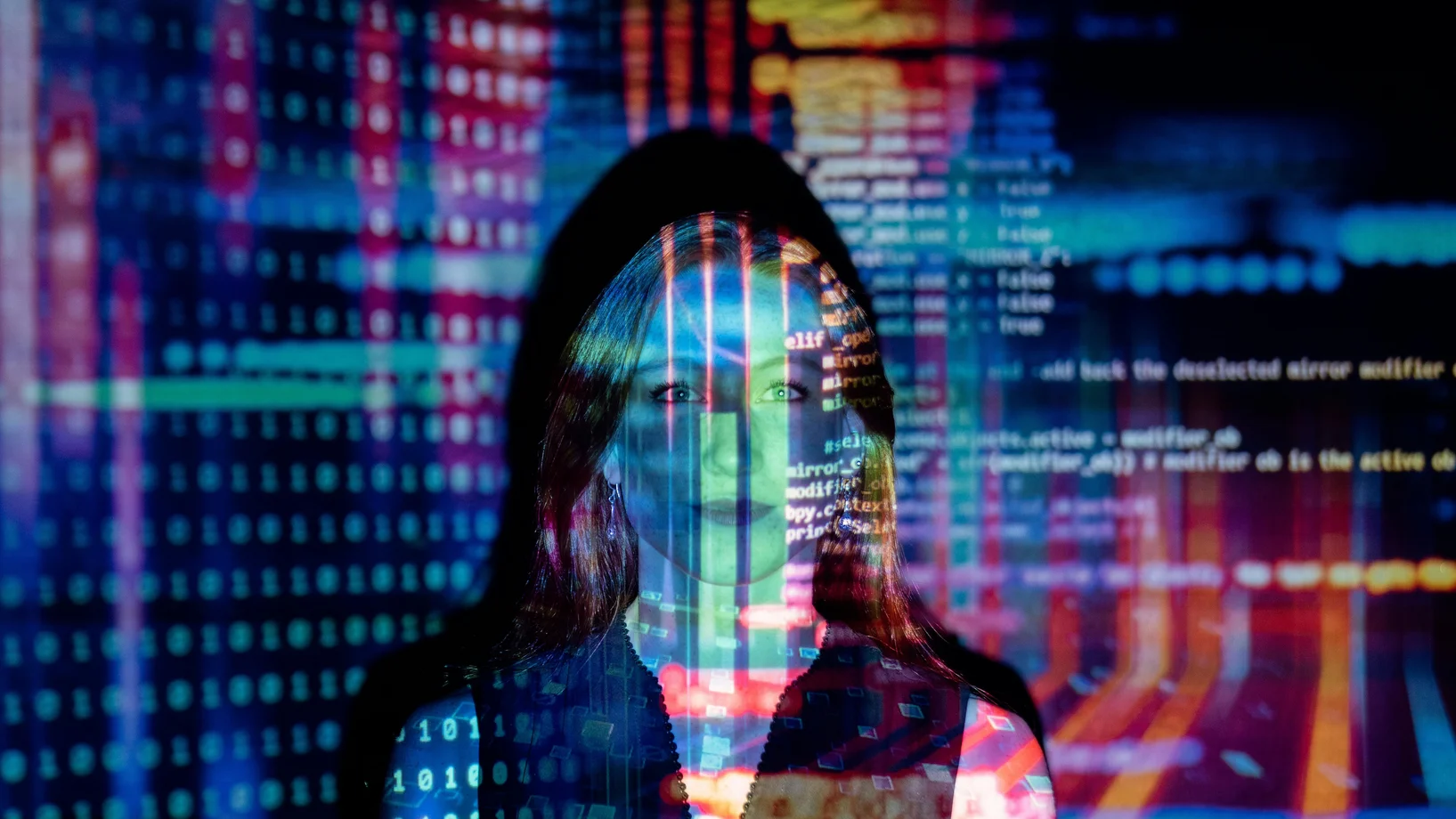 A woman with digital code projections on her face, representing technology and future concepts.